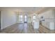 Bright living room and kitchen featuring tile floors, recessed lights, and modern finishes at 28003 N Faded Creek Dr, Florence, AZ 85132