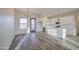 Spacious open layout featuring kitchen and living room with tile floors and bright natural light at 28003 N Faded Creek Dr, Florence, AZ 85132