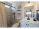 Modern bathroom with tiled shower, neutral walls, and contemporary fixtures at 3015 E Dahlia Dr, Phoenix, AZ 85032
