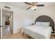 Bedroom featuring modern decor, wooden floors, and a ceiling fan at 3015 E Dahlia Dr, Phoenix, AZ 85032