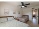 Inviting bedroom with two beds, ceiling fan, and neutral decor at 3015 E Dahlia Dr, Phoenix, AZ 85032