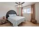 Bedroom featuring modern decor, wooden floors, and a ceiling fan at 3015 E Dahlia Dr, Phoenix, AZ 85032