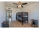 Bedroom with a bunk bed, wood floors, and neutral walls at 3015 E Dahlia Dr, Phoenix, AZ 85032