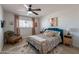 Cozy bedroom featuring a decorative bed, vintage chair, and stylish decor at 3015 E Dahlia Dr, Phoenix, AZ 85032