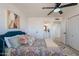 Stylish bedroom boasts a decorative bed, ceiling fan, and modern lighting at 3015 E Dahlia Dr, Phoenix, AZ 85032
