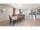 Bright dining room with a table and chairs and modern light fixture. Opens to kitchen at 3015 E Dahlia Dr, Phoenix, AZ 85032