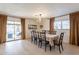 Bright dining room with a sliding glass door and a dining table set for six at 3015 E Dahlia Dr, Phoenix, AZ 85032