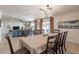 Bright dining area adjacent to the living room, featuring a dining table set for six at 3015 E Dahlia Dr, Phoenix, AZ 85032