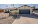 Charming home with low maintenance desert landscaping and a two-car garage at 3015 E Dahlia Dr, Phoenix, AZ 85032