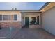 Inviting front porch with brick accents, covered entry and space to relax at 3015 E Dahlia Dr, Phoenix, AZ 85032