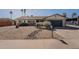 Well-maintained front yard with desert landscaping, offering curb appeal at 3015 E Dahlia Dr, Phoenix, AZ 85032