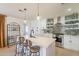 Bright and modern kitchen with white cabinets, stainless steel appliances, and bar seating at 3015 E Dahlia Dr, Phoenix, AZ 85032