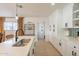 Bright kitchen featuring stainless appliances, white cabinets and a large island with seating at 3015 E Dahlia Dr, Phoenix, AZ 85032