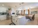 Bright, open kitchen featuring stainless appliances, white cabinetry, and a large island with a sink at 3015 E Dahlia Dr, Phoenix, AZ 85032