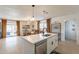 This well lit kitchen features stainless appliances, white cabinets and a large island with seating at 3015 E Dahlia Dr, Phoenix, AZ 85032