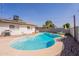 A refreshing pool complemented by solar panels on the home's roof and a well-maintained outdoor space at 3015 E Dahlia Dr, Phoenix, AZ 85032