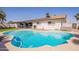 Back of house with view of backyard pool, patio and solar panels at 3015 E Dahlia Dr, Phoenix, AZ 85032