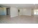 Spacious living area with slider to backyard and access to kitchen at 3249 E Sunnyside Ln, Phoenix, AZ 85032