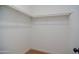 Walk-in closet with white walls and shelving at 3249 E Sunnyside Ln, Phoenix, AZ 85032