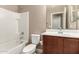 Bathroom features tile shower and vanity with basin sink and brushed hardware at 40049 W Hopper Dr, Maricopa, AZ 85138