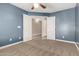 Bedroom features ceiling fan, and carpet flooring at 40049 W Hopper Dr, Maricopa, AZ 85138