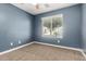 This bedroom features standard window, and carpet flooring at 40049 W Hopper Dr, Maricopa, AZ 85138