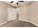 This bedroom features closet, ceiling fan, and carpet flooring at 40049 W Hopper Dr, Maricopa, AZ 85138