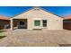 View of the back of the house with a covered patio and low-maintenance landscaping at 40049 W Hopper Dr, Maricopa, AZ 85138