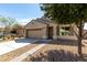 Charming single-Gathering home featuring a two-car garage, neutral stucco, and a well-maintained landscape at 40049 W Hopper Dr, Maricopa, AZ 85138