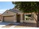 Charming single-Gathering home featuring a two-car garage, neutral stucco, and a well-maintained landscape at 40049 W Hopper Dr, Maricopa, AZ 85138