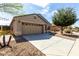 Charming single-Gathering home featuring a two-car garage, neutral stucco, and a well-maintained landscape at 40049 W Hopper Dr, Maricopa, AZ 85138