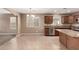 Well-lit kitchen featuring tile floors, sleek appliances, granite countertops, and a functional center island at 40049 W Hopper Dr, Maricopa, AZ 85138