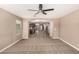 Spacious living room flows into open kitchen with modern appliances and a convenient center island at 40049 W Hopper Dr, Maricopa, AZ 85138