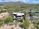 Gorgeous aerial view of desert home and community, featuring desert landscaping and mountain views at 40478 N 108Th Pl, Scottsdale, AZ 85262