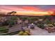 Inviting patio view with a fire pit and desert sunset backdrop at 40478 N 108Th Pl, Scottsdale, AZ 85262