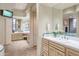 Bright bathroom with dual sinks, ample counter space, and a large mirror reflecting the natural light at 40478 N 108Th Pl, Scottsdale, AZ 85262