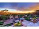 Outdoor fire pit with seating and beautiful sunset views of the desert landscape at 40478 N 108Th Pl, Scottsdale, AZ 85262