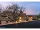 Exterior view of home's entrance with desert landscaping and driveway at 40478 N 108Th Pl, Scottsdale, AZ 85262