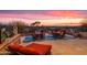 Spacious outdoor patio with dining and lounge furniture, perfect for entertaining with desert views at 40478 N 108Th Pl, Scottsdale, AZ 85262