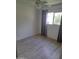 A bright bedroom has wood floors, a ceiling fan, and a window with natural light creating an inviting atmosphere at 4304 N Parkway Ave, Scottsdale, AZ 85251