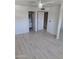 A bright bedroom features modern floors, a ceiling fan and access to an en-suite bathroom, perfect for relaxed living at 4304 N Parkway Ave, Scottsdale, AZ 85251