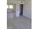 A spacious bedroom features sliding closet doors and wood floors, offering both style and practicality at 4304 N Parkway Ave, Scottsdale, AZ 85251