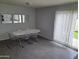 Bright dining area with modern table and chairs next to a sliding door at 4304 N Parkway Ave, Scottsdale, AZ 85251