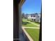 View from window of a well-maintained two-story apartment with neatly manicured lawns and lush shrubbery at 4304 N Parkway Ave, Scottsdale, AZ 85251