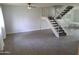Spacious living room with lots of natural light, adjacent to a staircase at 4304 N Parkway Ave, Scottsdale, AZ 85251