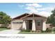 Charming single-story home with a two-car garage, beautiful landscaping, and neutral color palette at 4661 E French Rd, San Tan Valley, AZ 85143