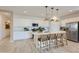 Modern kitchen with white cabinetry, quartz countertops, stainless steel appliances, and a large kitchen island at 4661 E French Rd, San Tan Valley, AZ 85143