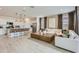 Bright open-concept living area featuring modern furnishings, a large island, and a neutral color scheme at 4661 E French Rd, San Tan Valley, AZ 85143