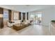 Inviting living room with a large sliding glass door, neutral tones, stylish decor, and comfortable seating at 4661 E French Rd, San Tan Valley, AZ 85143