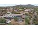 An aerial view showcases the home's layout, desert landscape, outdoor living spaces and mountain views at 49011 N 7Th Ave, New River, AZ 85087